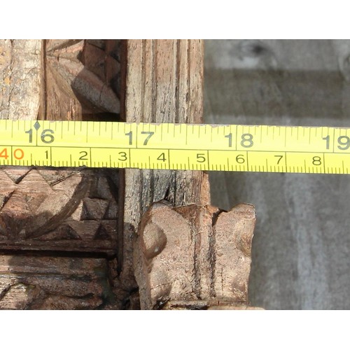 227 - A rustic wooden window shutter with iron fittings and carved details