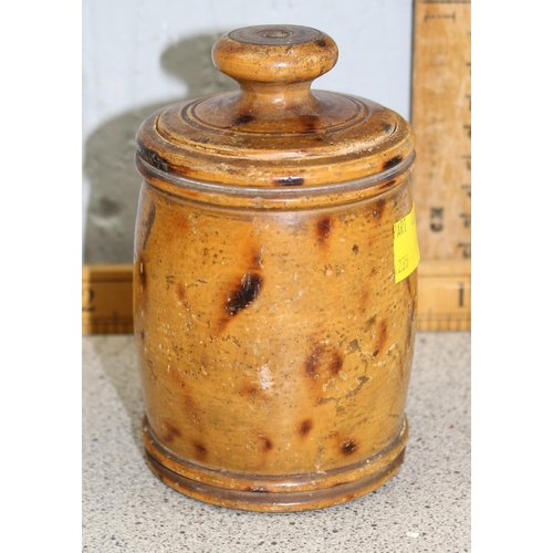 235 - A gothic style carved oak bookslide and a treen lidded pot (2)