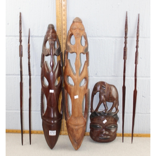 1733 - Qty of African carved wooden items to inc 3 masks, wooden spears etc etc