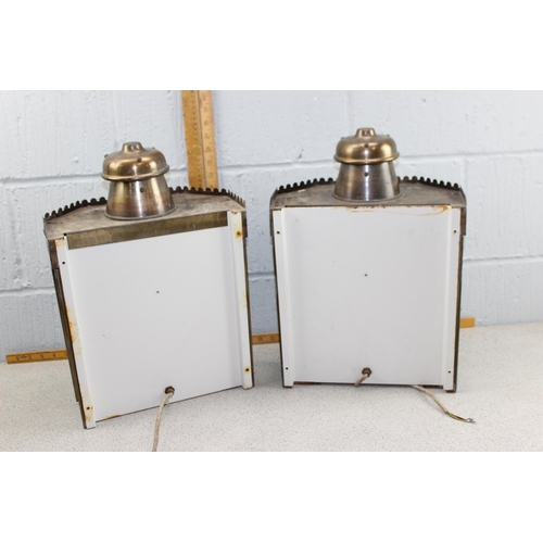 209 - A pair of vintage brass and bevelled glass wall lights