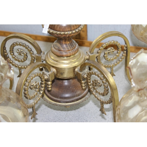 210 - A large hanging brass and glass chandelier light fitting