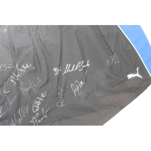 348 - Framed and mounted Bath Rugby club puma shorts with team signatures with Superstars label to reverse