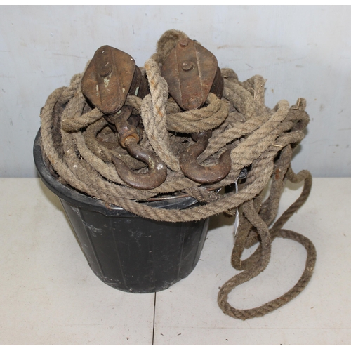 Vintage block and tackle in bucket, with rope