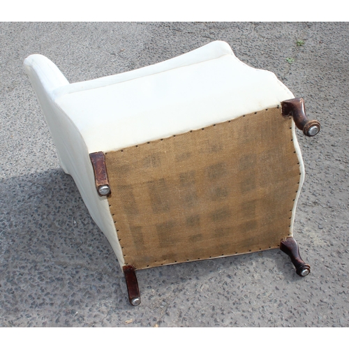 149E - A Victorian deep seated armchair in the manner of Howard & Sons, ready for upholstery