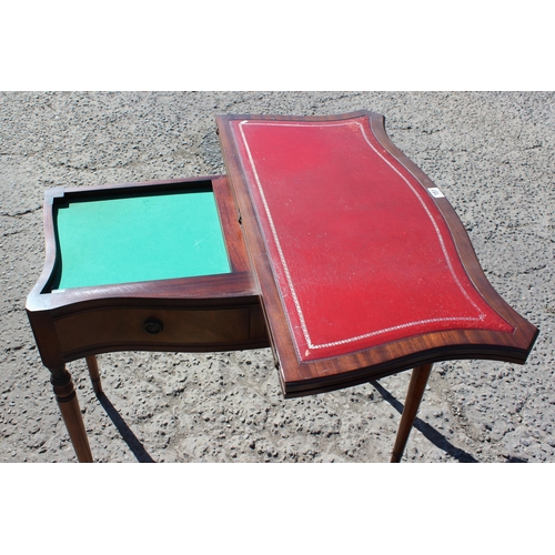 149s - 2 drawer leather topped twist top tea table