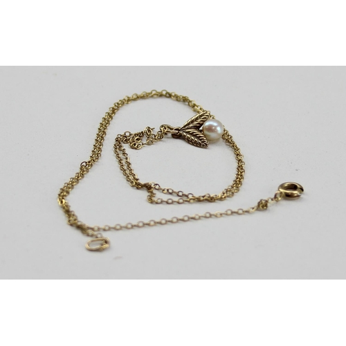 1222 - 9ct gold and seed pearl pendant on 9ct gold chain, approx 1.46g gross