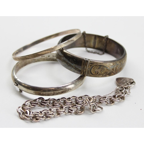 1225 - 3 silver cuff bangles and a silver padlock bracelet, approx 66.36g gross