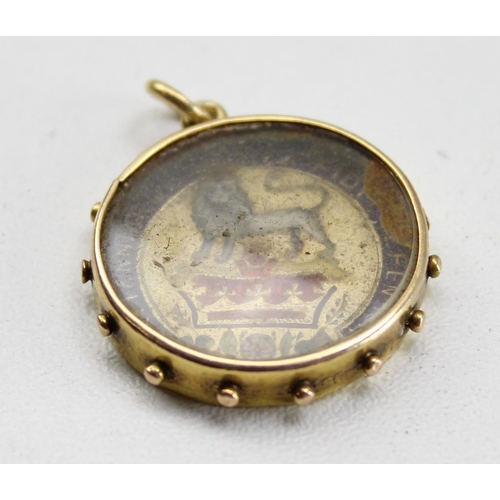 1227 - An 18ct gold mounted 1826 silver shilling coin pendant or fob with enamel decoration, mount marked 1... 