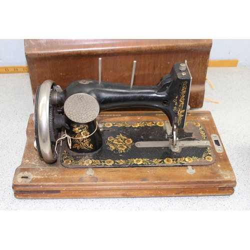 947 - Vintage hand-crank sewing machine in wooden case with key