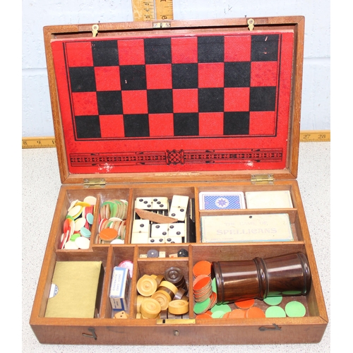 1533 - An antique wooden cased games compendium with Moroccan leather games board, various vintage and late... 