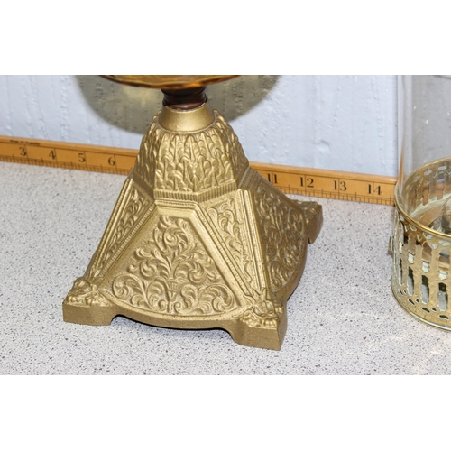 212 - 2 antique oil lamps with cast iron bases and a brass candle lantern (3)