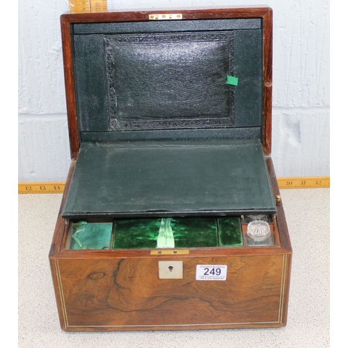 249 - An antique mahogany travelling vanity box, with fitted interior, containing cut glass and silver pla... 