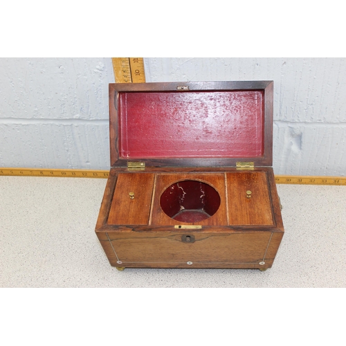 249b - A 19th century Rosewood sarcophagus shaped tea caddy with mother of pearl inlay