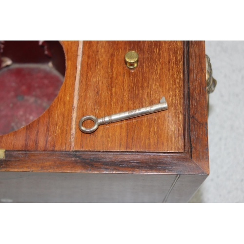 249b - A 19th century Rosewood sarcophagus shaped tea caddy with mother of pearl inlay