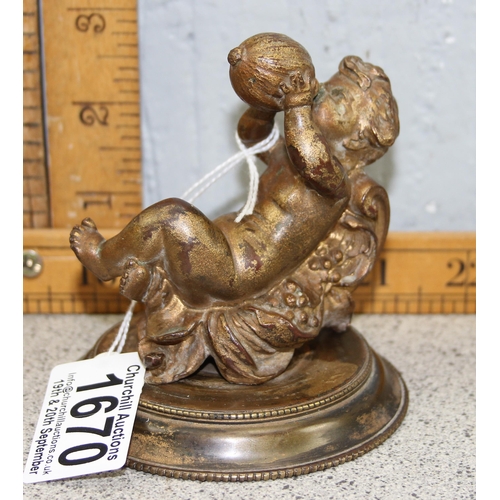 1670 - An antique cast bronze paper or desk weight formed as a Bacchanalian cherub drinking from a gourd, l... 