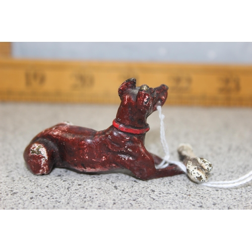 1671 - A small cold painted cast bronze figure of a dog with bone, bearing Bergmann stamp verso, approx 7cm... 