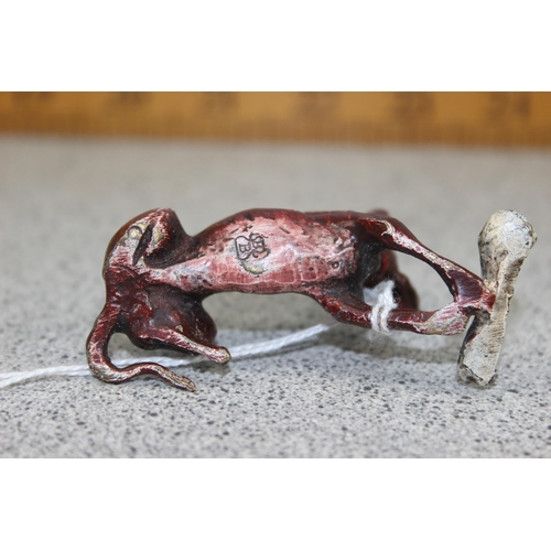 1671 - A small cold painted cast bronze figure of a dog with bone, bearing Bergmann stamp verso, approx 7cm... 