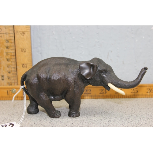 1672 - A cast bronze figure of an elephant, likely 20th century, approx 16cm long, unmarked