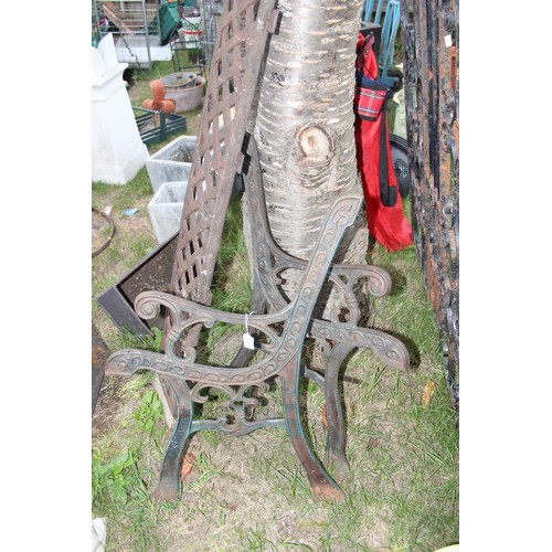 264 - A pair of cast iron bench ends, back and some wooden slats