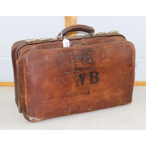 215 - A vintage leather travelling bag with fitted interior, Gladstone type, early 20th century