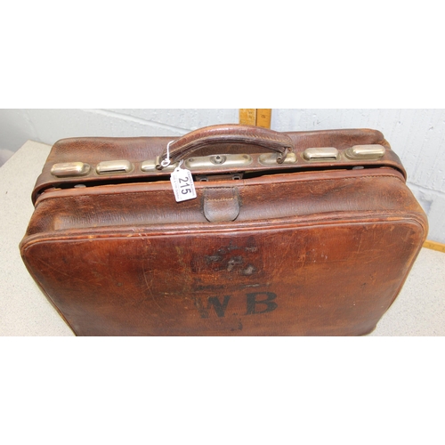 215 - A vintage leather travelling bag with fitted interior, Gladstone type, early 20th century