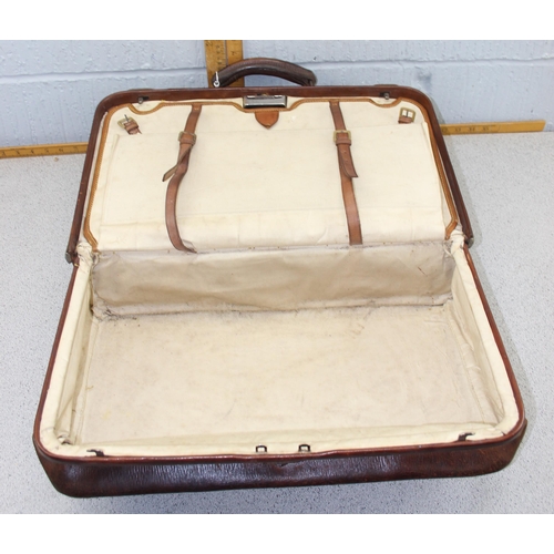 215 - A vintage leather travelling bag with fitted interior, Gladstone type, early 20th century