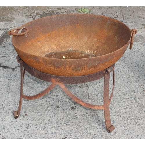 301 - A large metal fire pit or brazier