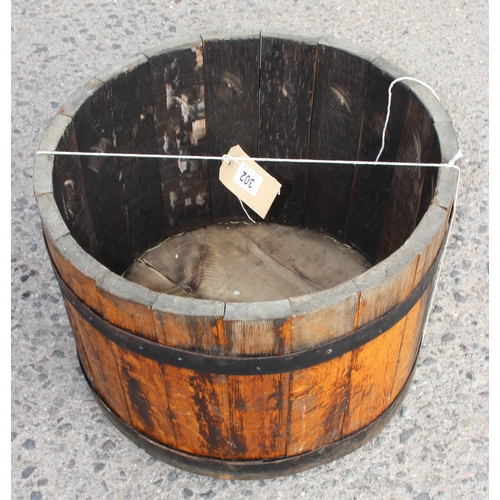 302 - A vintage coopered wooden barrel planter