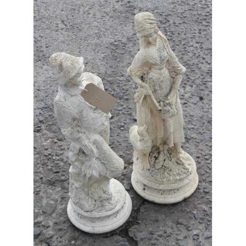 307 - A pair of concrete garden figures formed as a shepherd & shepherdess