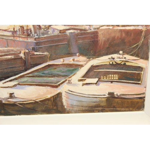 403 - Rodney Charman (1944 - present) British. An oil on canvas showing a quayside scene with many wooden ... 