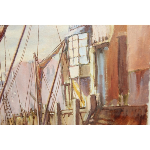 403 - Rodney Charman (1944 - present) British. An oil on canvas showing a quayside scene with many wooden ... 