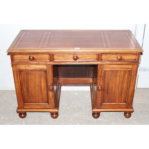 108 - A vintage small mahogany 3 drawer desk with leather inset top