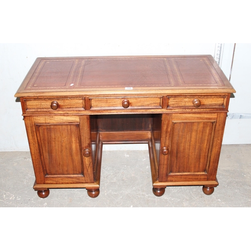 108 - A vintage small mahogany 3 drawer desk with leather inset top