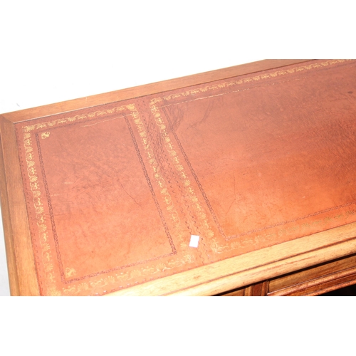 108 - A vintage small mahogany 3 drawer desk with leather inset top