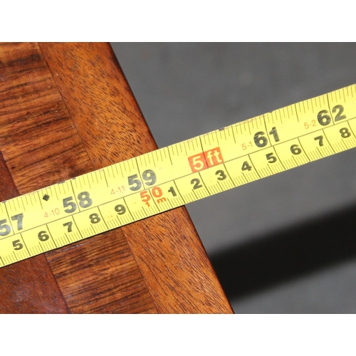 109 - An antique mahogany sofa table with hidden drawers and drop ends with crossbanded decoration