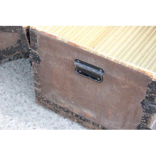 115 - A vintage iron banded dome topped travel trunk