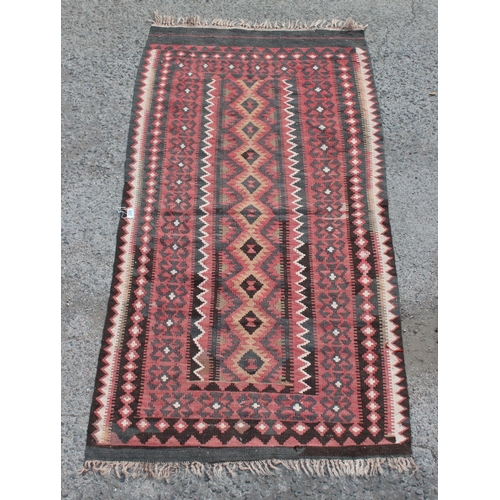 200 - A flatweave Kilim rug with geometric patterns, approx 190cm x 105cm