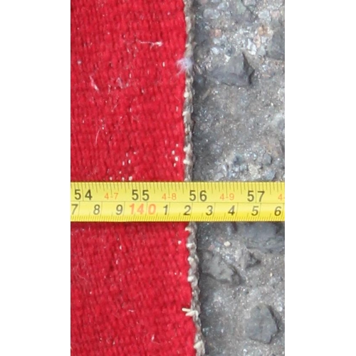 202 - A vintage flatweave rug with red ground and geometric diamonds pattern, approx 145cm x 85cm