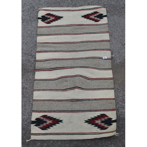 208 - A cream and grey ground flatweave rug, approx 155cm x 80cm