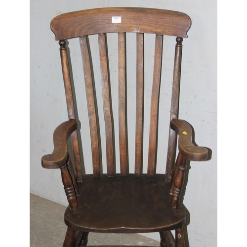 98 - An antique slatback farmhouse Windsor armchair