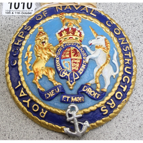 1010 - An unusual painted cast brass plaque for the Royal Corps of Naval Constructors