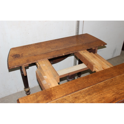 12 - An antique oak drop leaf extending table