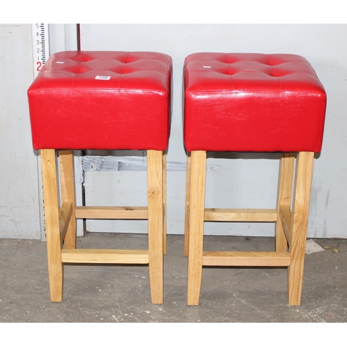 128 - A pair of red topped stool