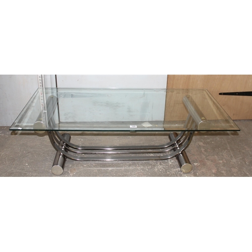 129 - A retro style glass topped coffee table with chrome base