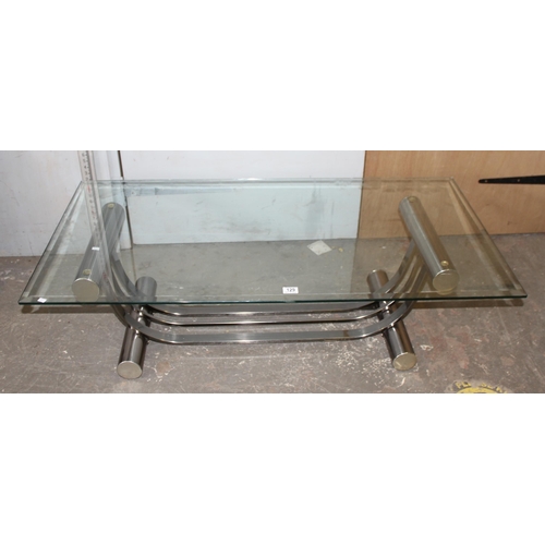 129 - A retro style glass topped coffee table with chrome base