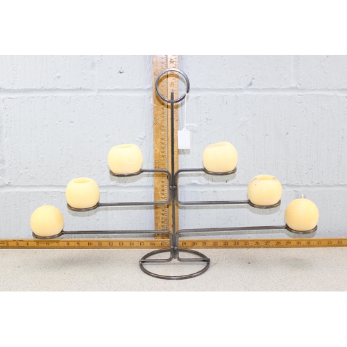 1782 - A wrought iron candle stand with candles