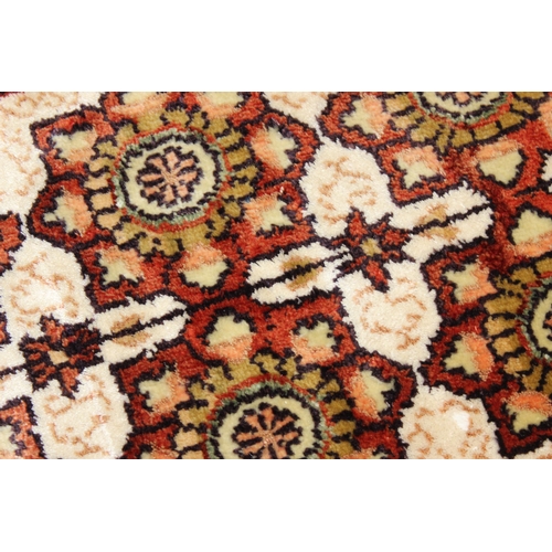 221 - A small finely woven rug of red and cream ground, believed to be silk, knot count approximately 360 ... 