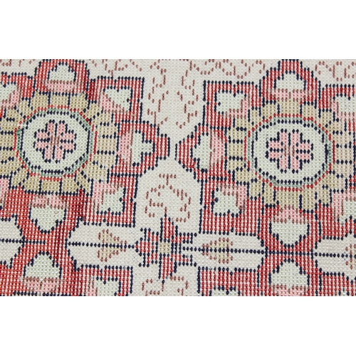 221 - A small finely woven rug of red and cream ground, believed to be silk, knot count approximately 360 ... 