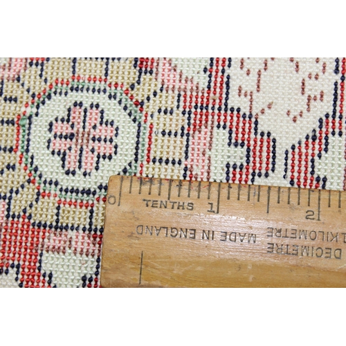 221 - A small finely woven rug of red and cream ground, believed to be silk, knot count approximately 360 ... 