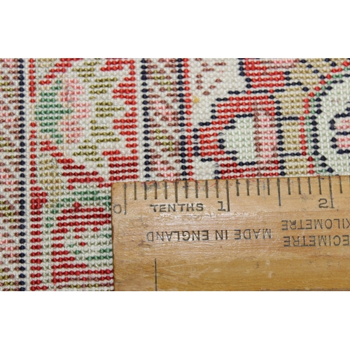 221 - A small finely woven rug of red and cream ground, believed to be silk, knot count approximately 360 ... 